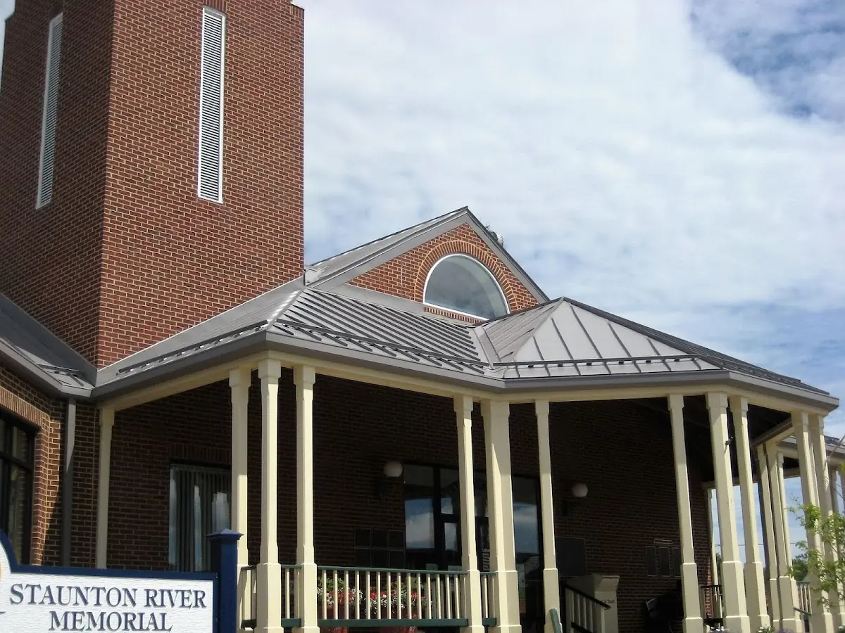 Skilled roofing craftsmen working on a residential roof in Niles